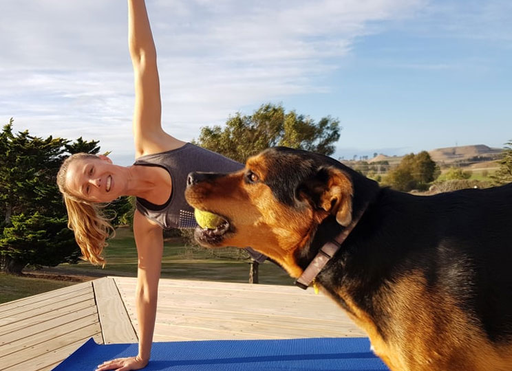 maria doing yoga with her dog